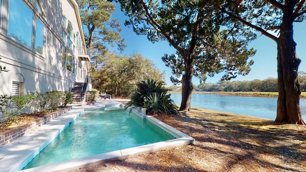 private pool overlooking the lagoon of a Hilton Head vacation home