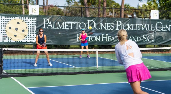 group of women playing pickleball on the courts at Palmetto Dunes Pickleball Center