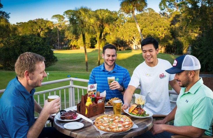 Guys eating at golf course