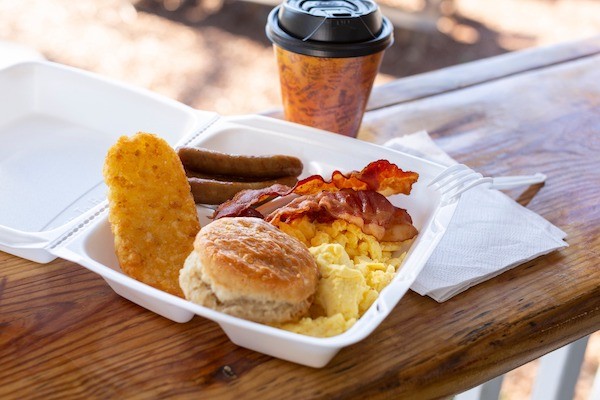 take out box of breakfast from The General Store including a hash brown, biscuit, eggs, bacon, and sausage