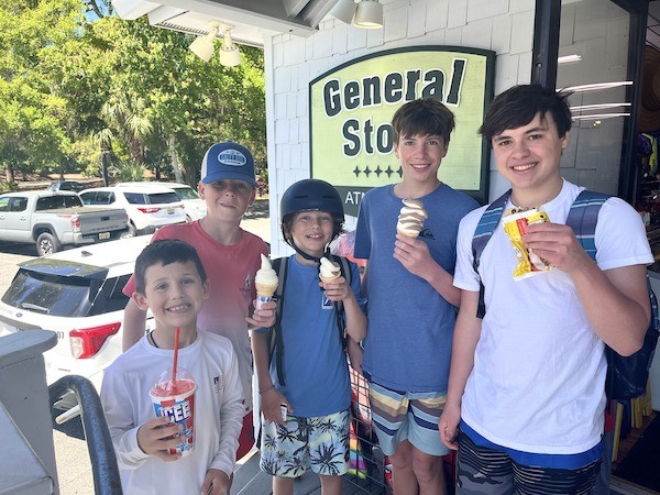 boys with ice cream and slushies outside of the General Store