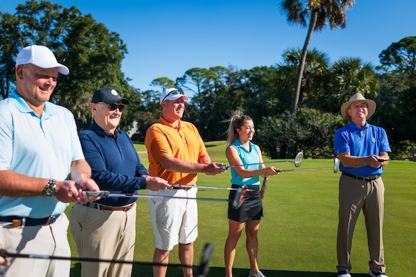 Group of golfers receiving golf lessons from Doug Weaver at Palmetto Dunes Golf Academy