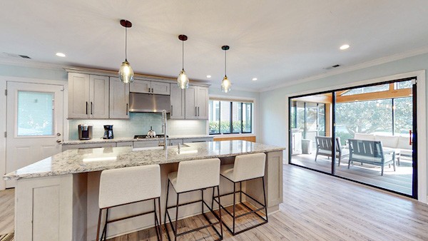 Modern and updated white kitchen with bar seating of Palmetto Dunes Vacation Rental