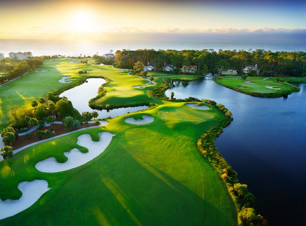 Aerial view of hole 10 and 11 with lakes of the Robert Trent Jones golf course at sunrise