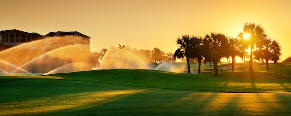 Jones golf course at sun rise with sprinklers