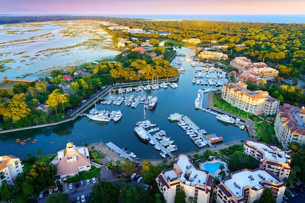 aerial view of the Shelter Cove Harbour and Marina with sunset skies