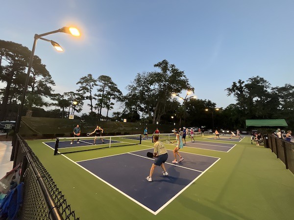 pickleball event with lights on at night