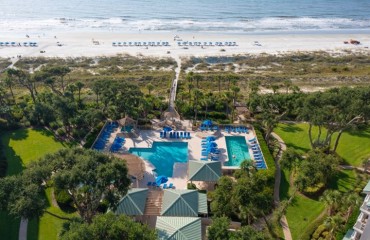 Hampton Place Complex at Palmetto Dunes Resort showing an aerial view of the beach and pool