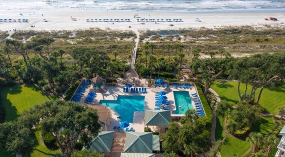 Hampton Place Complex at Palmetto Dunes Resort showing an aerial view of the beach and pool