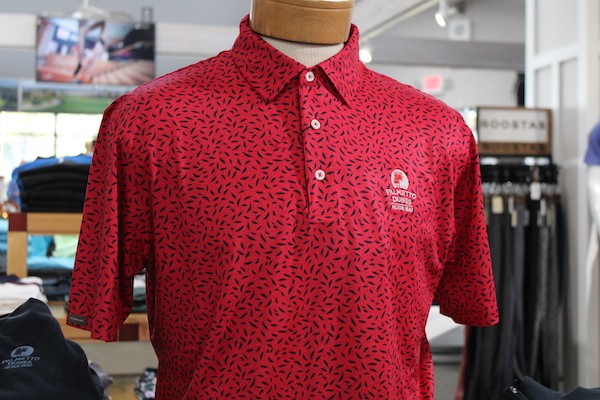 Red patterned Polo by Dunning Golf with Palmetto Dunes logo on display