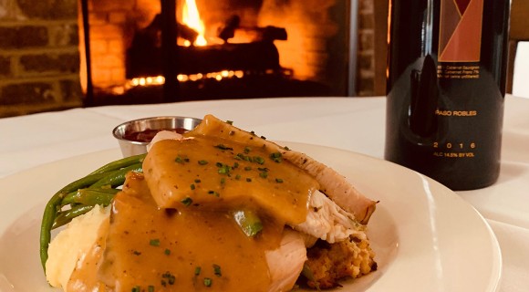 Thanksgiving dinner by the fireplace at Alexander's Restaurant