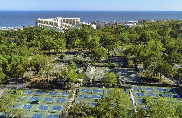 aerial view of palmetto dunes pickleball courts with ocean in the far distance
