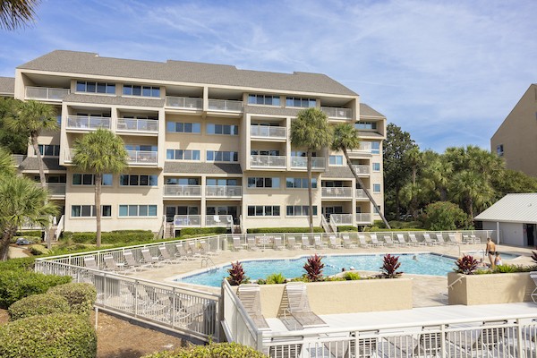 resort pool and lounge chairs of Captains Cove