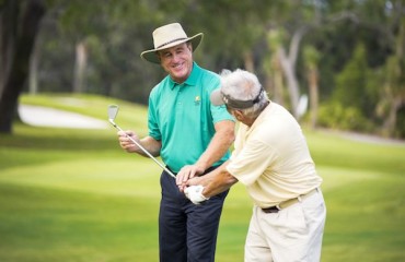 Doug Weaver teaches swing technique to student