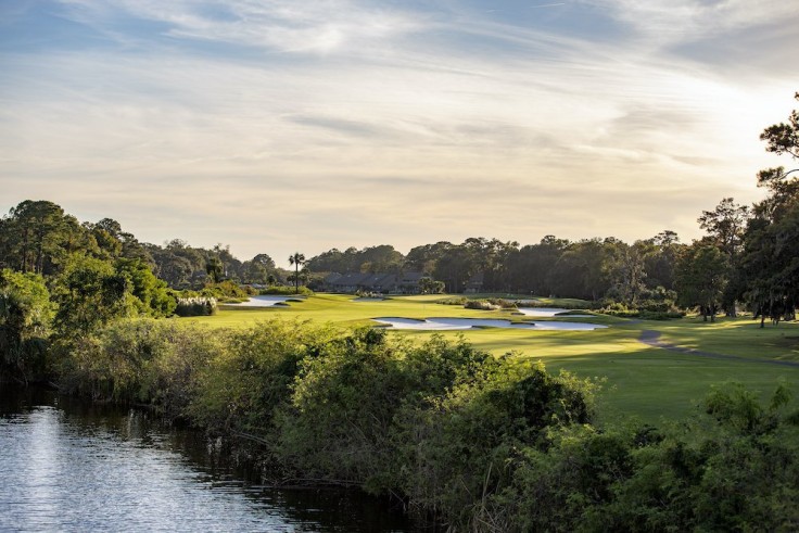 golf course greenery by water