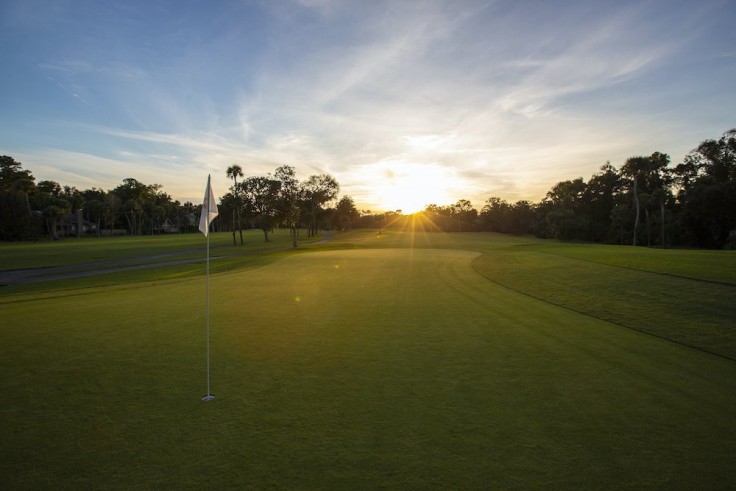 sunrise over golf course hole