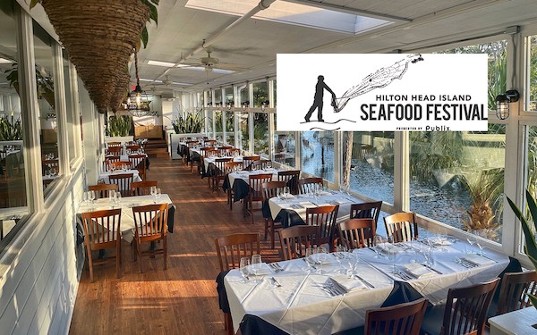 Alexander's sunroom overlooking the lagoon with Hilton Head Seafood Festival logo