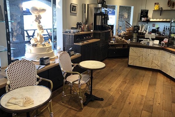 Interior shot of Hilton Head Social Bakery with table and chairs and counter in background