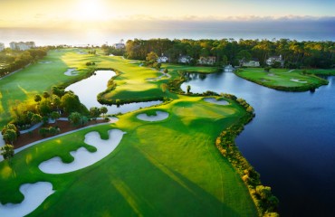 aerial view of the 10th hole of Robert Trent Jones course with sun in the background