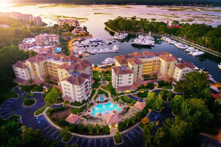 aerial view of condos and shops along marina at shelter cove harbor and marina