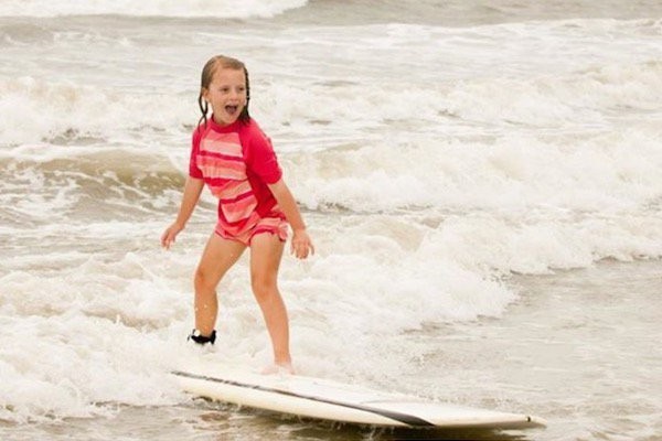 little girl surfing