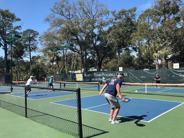 pickleball players playing on several courts at palmetto dunes tennis and pickleball center