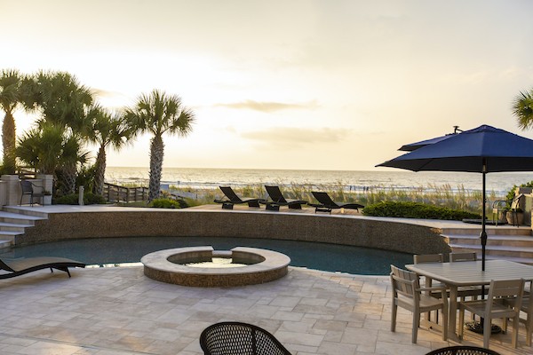 gorgeous oceanfront pool and lounge chairs at private Palmetto Dunes Oceanfront Vacation Rental