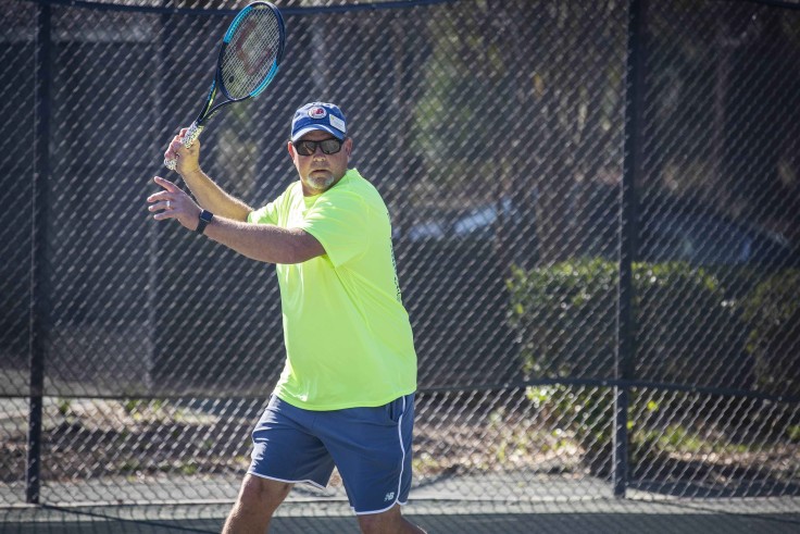 Palmetto Dunes Tennis Instructor taking a swing on the tennis court