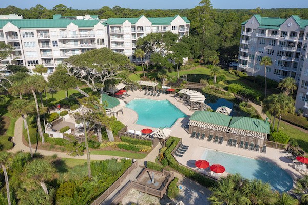aerial view of the two pools and buildings of the Windsor Court Oceanfront Complex
