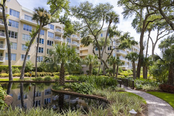 pond surrounded by walkway and trees at Windsor Place