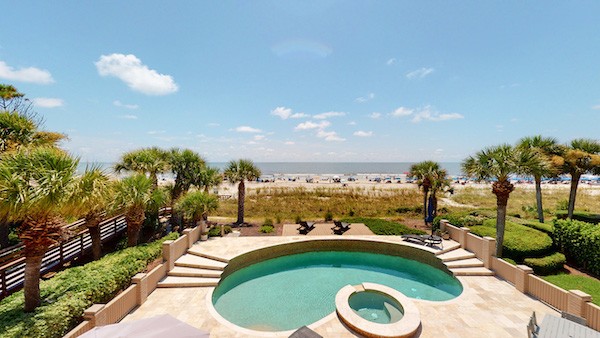 view from private balcony of Palmetto Dunes Oceanfront Vacation home overlooking the private pool and beach