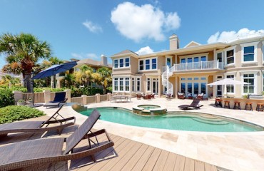 private pool and lounge area of a large Palmetto Dunes Vacation Rental
