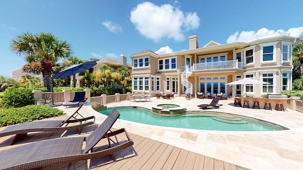 private pool and lounge area of a large Palmetto Dunes Vacation Rental