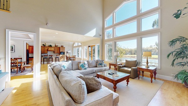 large windows of the open living room of Port Tack vacation home