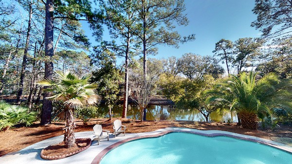 private pool and back yard overlooking the Palmetto Dunes lagoon