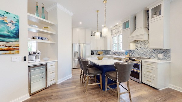 beautiful upgraded modern kitchen with bar seats of a Hilton Head Island vacation rental