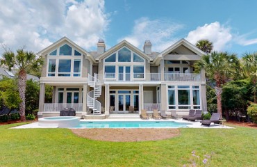 Rear view of Palmetto Dunes Oceanfront vacation rental with large windows and private pool and spa