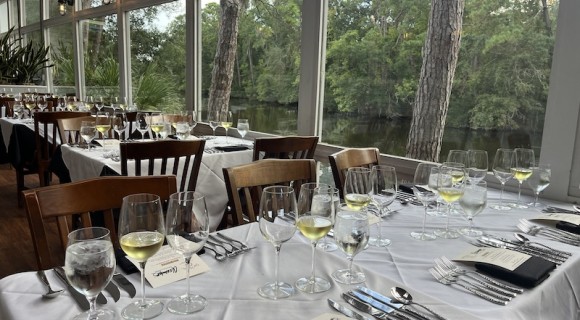 tables set up for a wine dinner overlooking the lagoon at Alexander's Restaurant