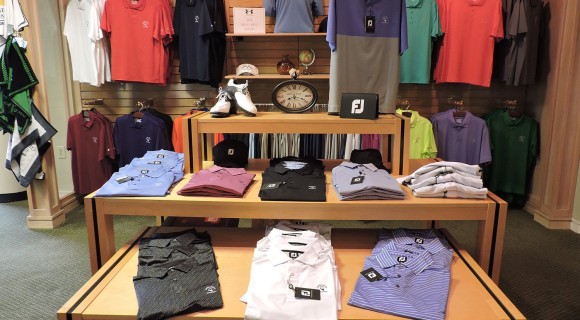 Display of hanging and folded shirts at a golf Pro shop
