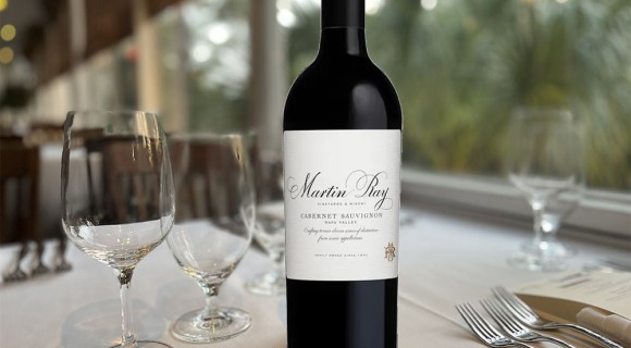 Martin Ray wine bottle on table setting in the sunroom of Alexander's Restaurant