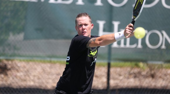 Sarah Ansboury hitting pickleball with serious face