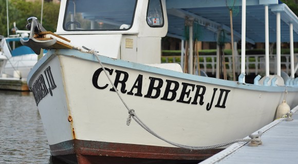 Close up of front of a crabbing boat docked at marina