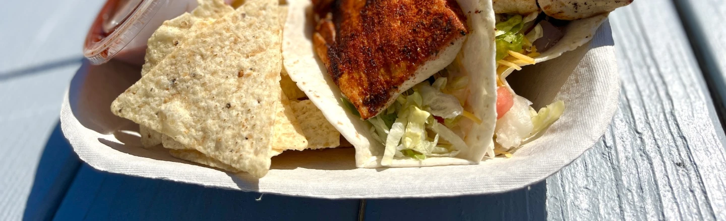 close up of fish tacos from the Dunes House with a hot dog in the background