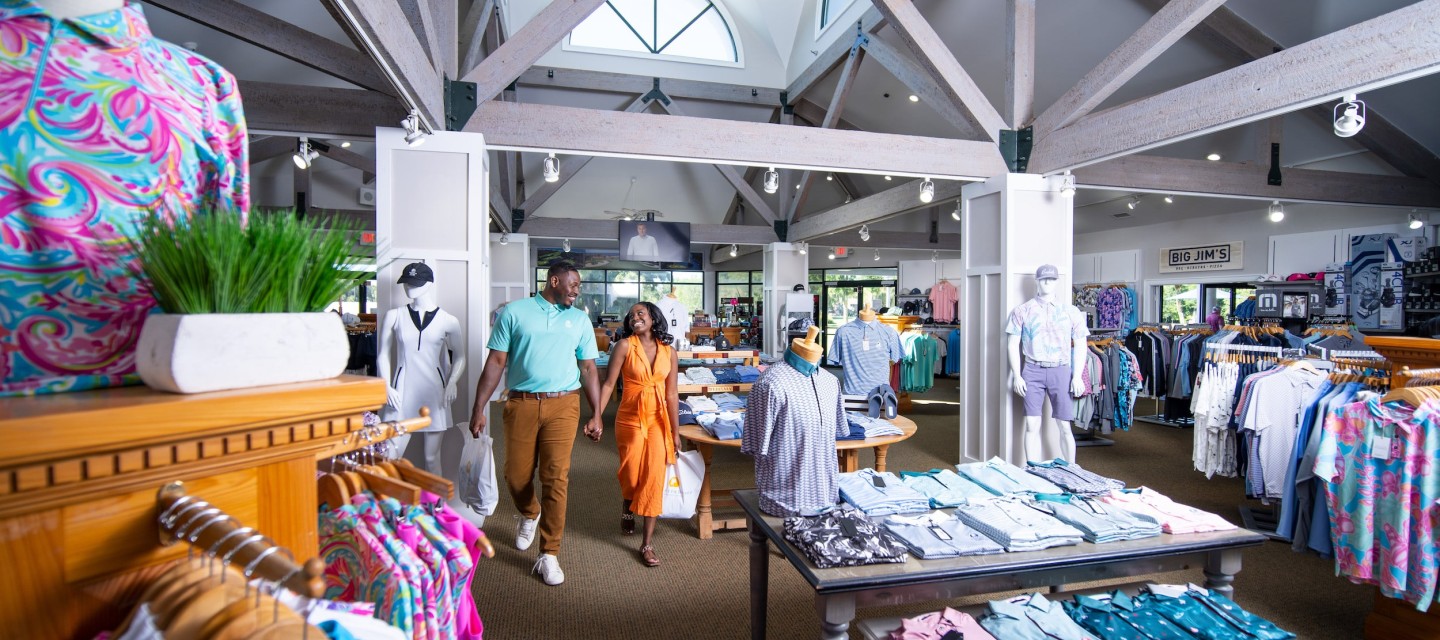 couple holding hands shopping at Robert Trent Jones Pro Shop