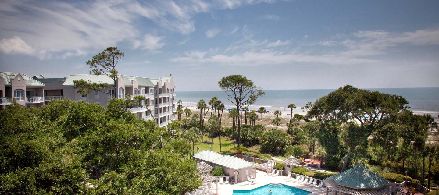 aerial view of pool and ocean from balcony